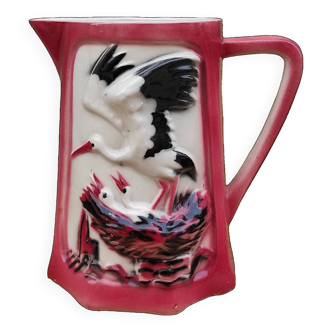 French vintage pitcher of St Clément, with a stork feeding its babies