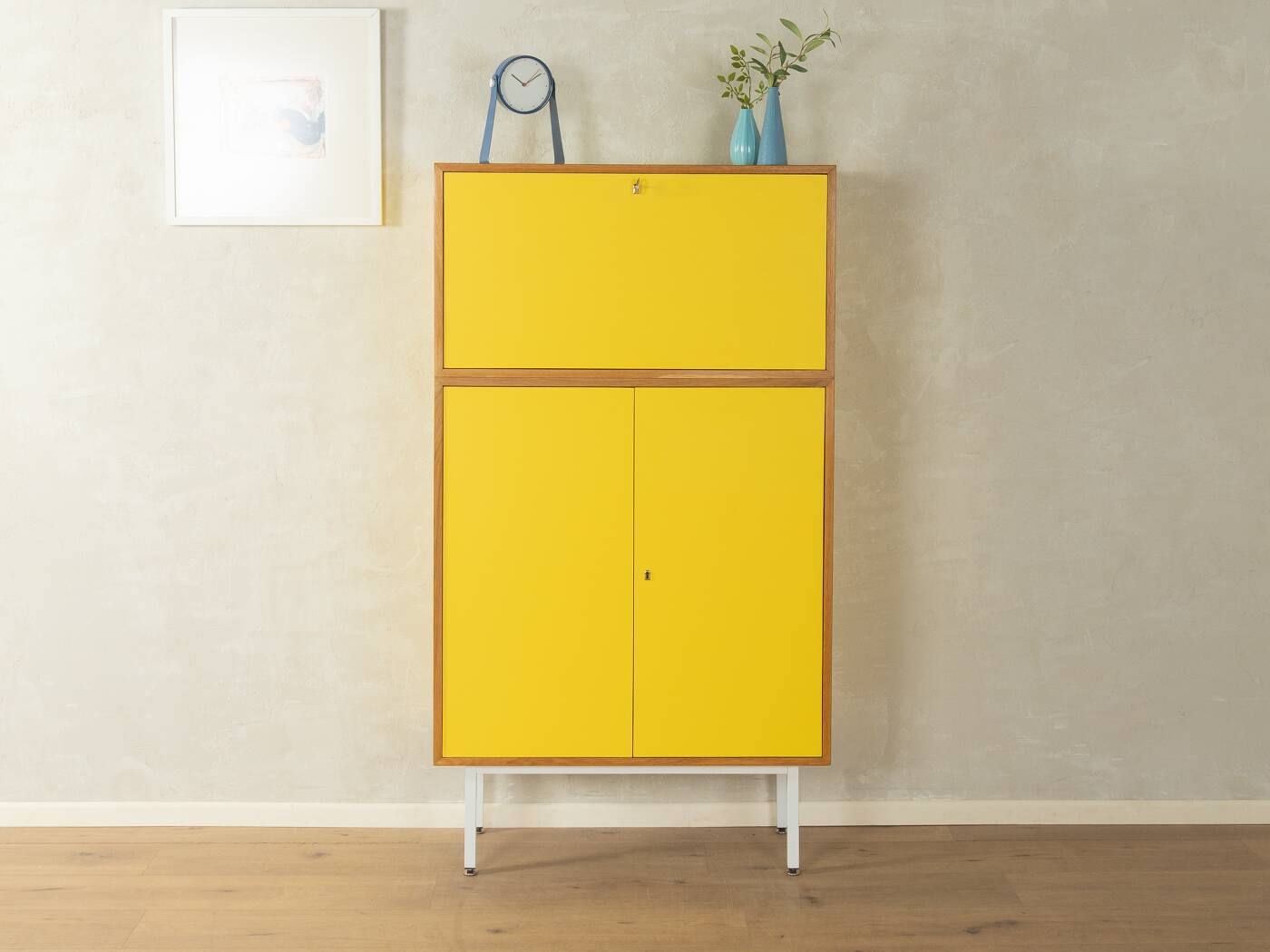 Classic sideboard from the 1960s, oak veneer, yellow Resopal, white steel feet