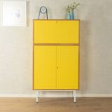 Classic sideboard from the 1960s, oak veneer, yellow Resopal, white steel feet