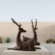 Solid bronze deer 20kg (1979), with period sales certificate.