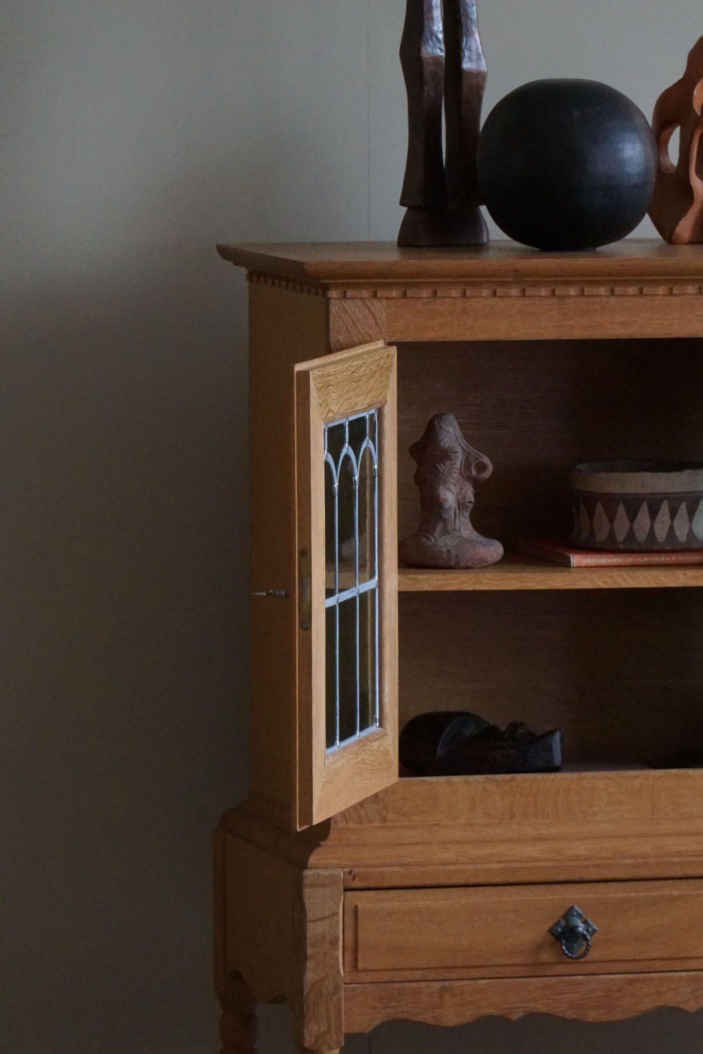 20th-century solid oak display cabinet with a glass front, by a Danish cabinetmaker.