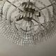 Cascading chandelier with crystal and silvered bronze pendants