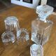 Mismatched decanter and whiskey glasses