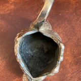 Empty pocket - bronze swan