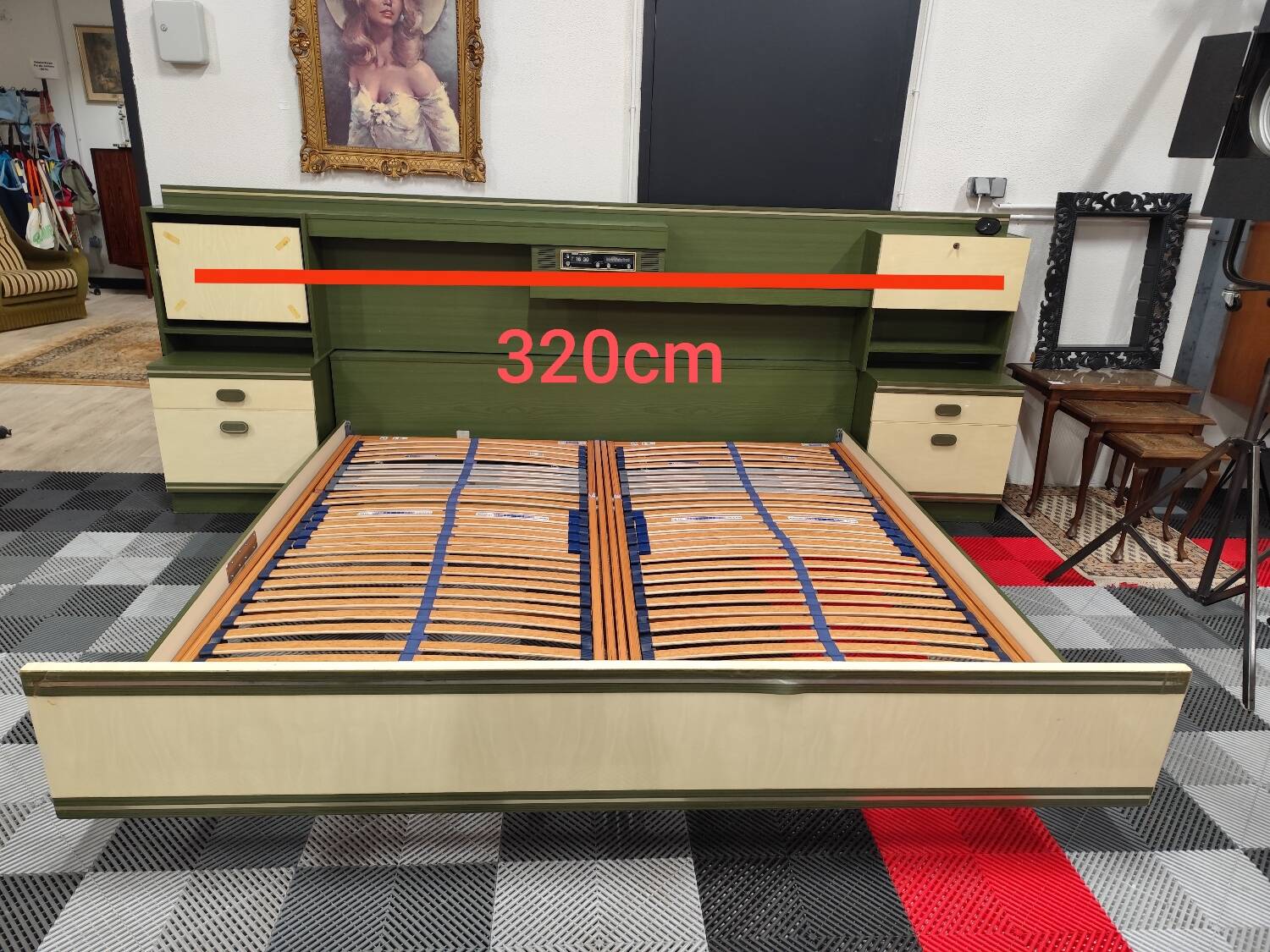 Vintage king-size bed with headboard furniture and built-in radio.