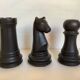 Trio of chess game candlesticks, rook, knight, pawn