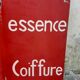 Tole sign painted "bar tobacco essence hairstyle"