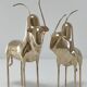 Two stylized zebu with long vintage brass horns