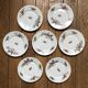 Set of 7 dessert plates in porcelain, butterfly pattern and wheat sheaves.