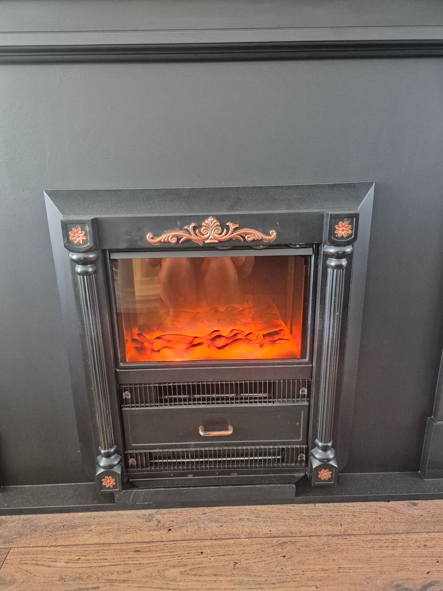 Luxury electric fireplace and classic black mantel suite
