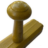 Old yellow wall coat rack