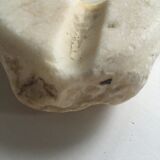 White marble ashtray with a raw appearance