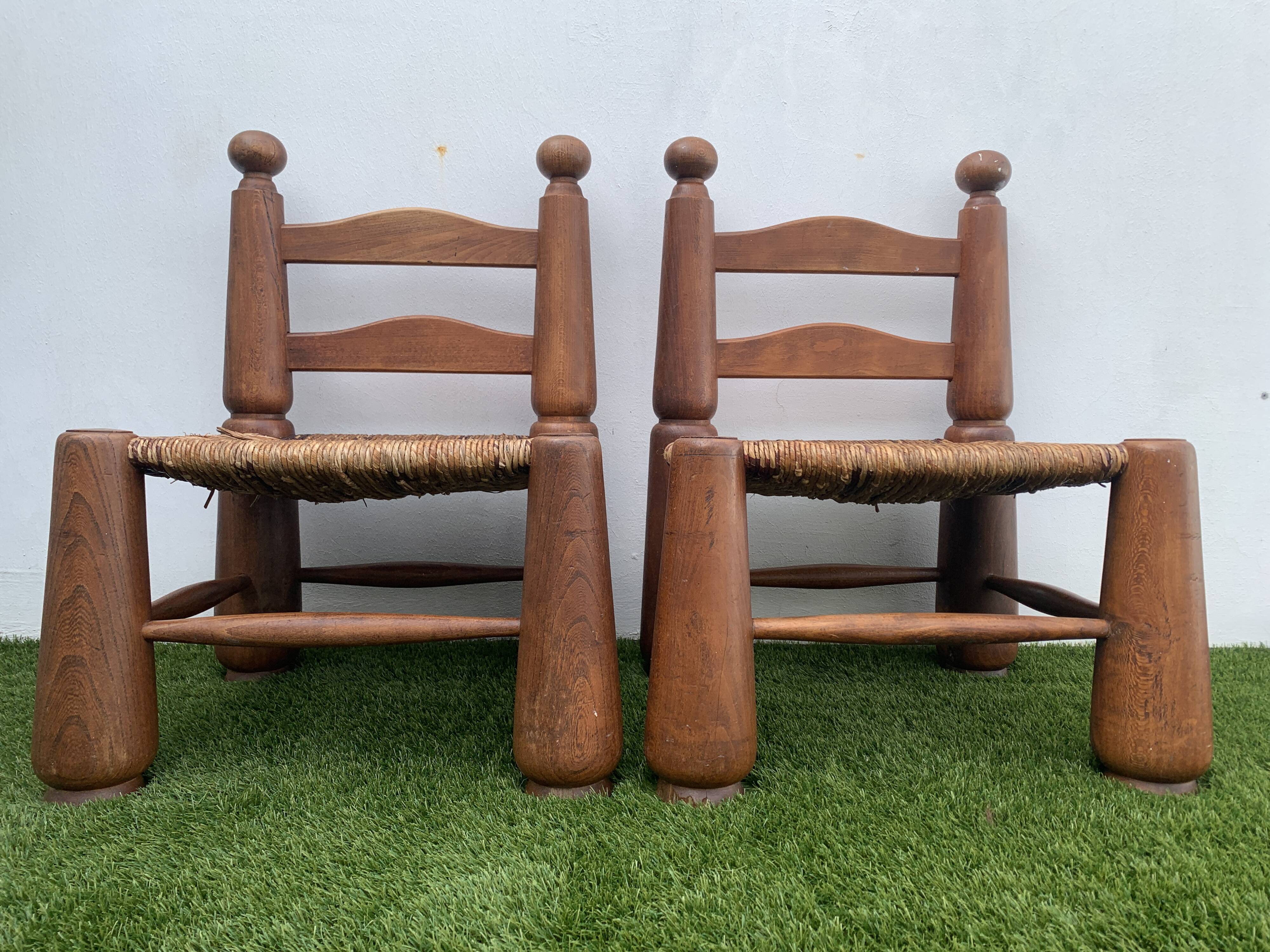 Pair of antique low fire chairs made of wood and straw
