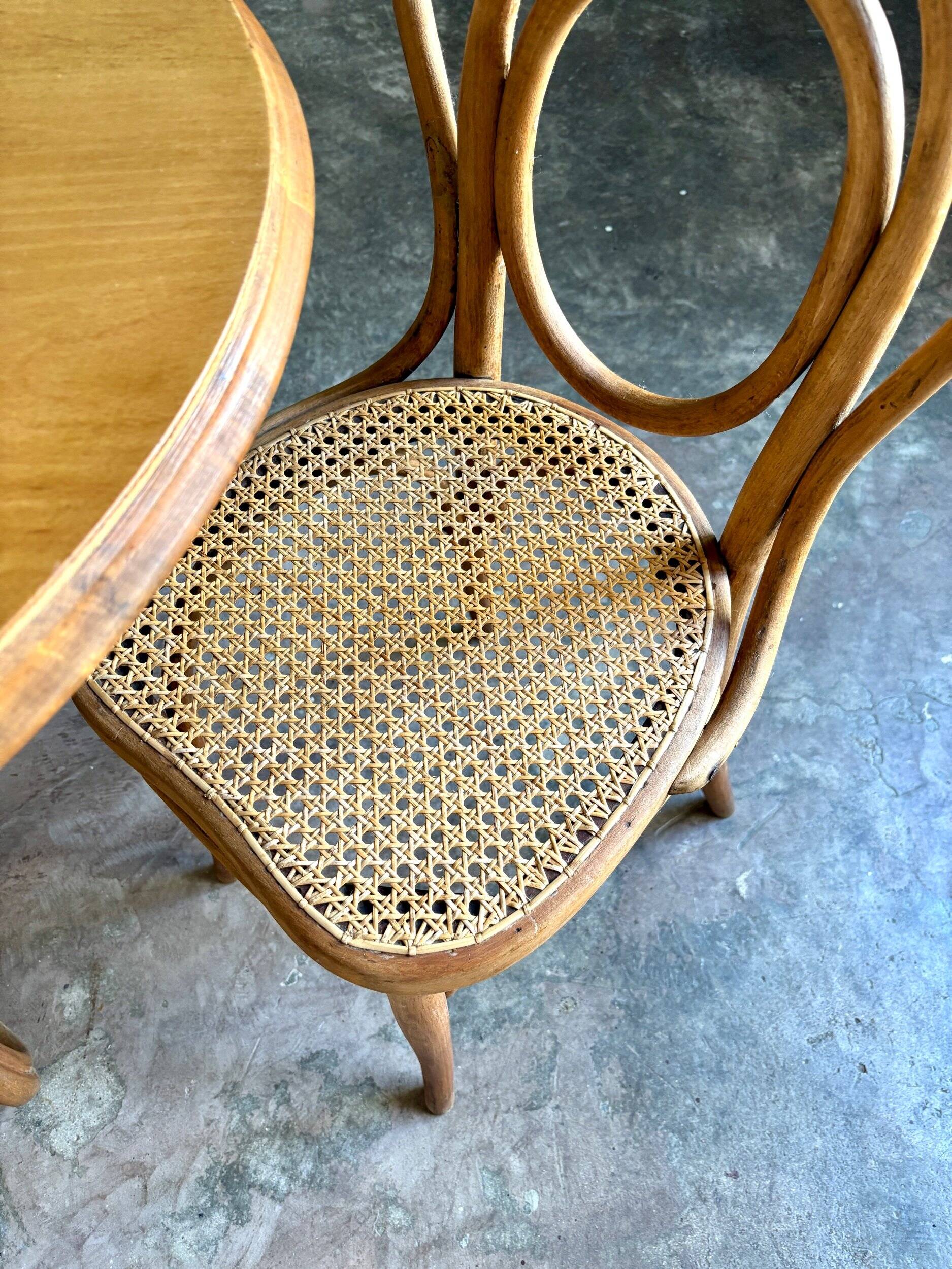 Thonet table no. 3 and 4 bent beech chairs with caning, circa 1890.