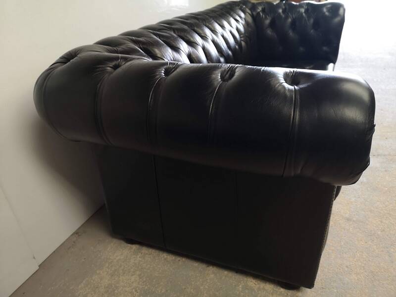 Black leather chesterfield sofa