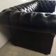 Black leather chesterfield sofa