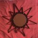 Old wrought metal sun mirror