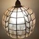 Mother-of-pearl and brass suspension