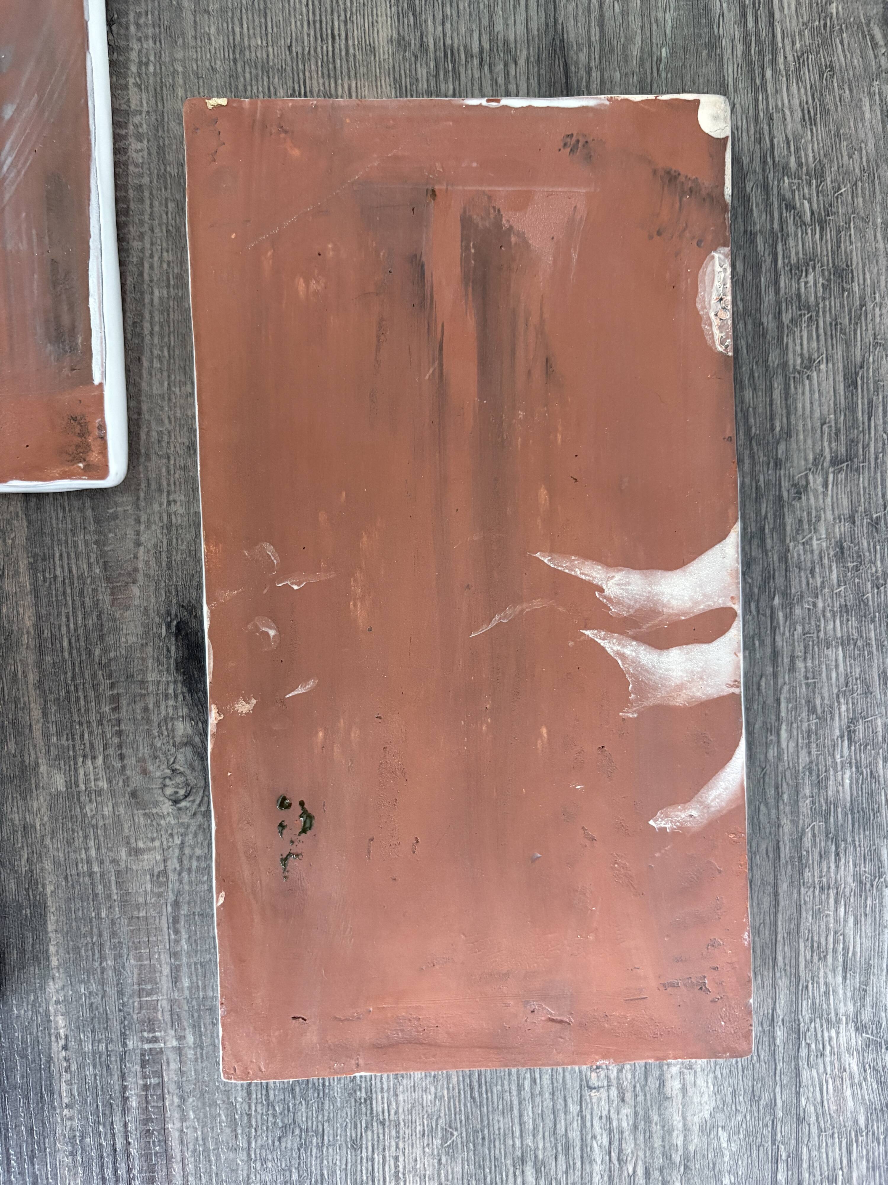 Lot of 4 rectangular glazed terracotta plates.