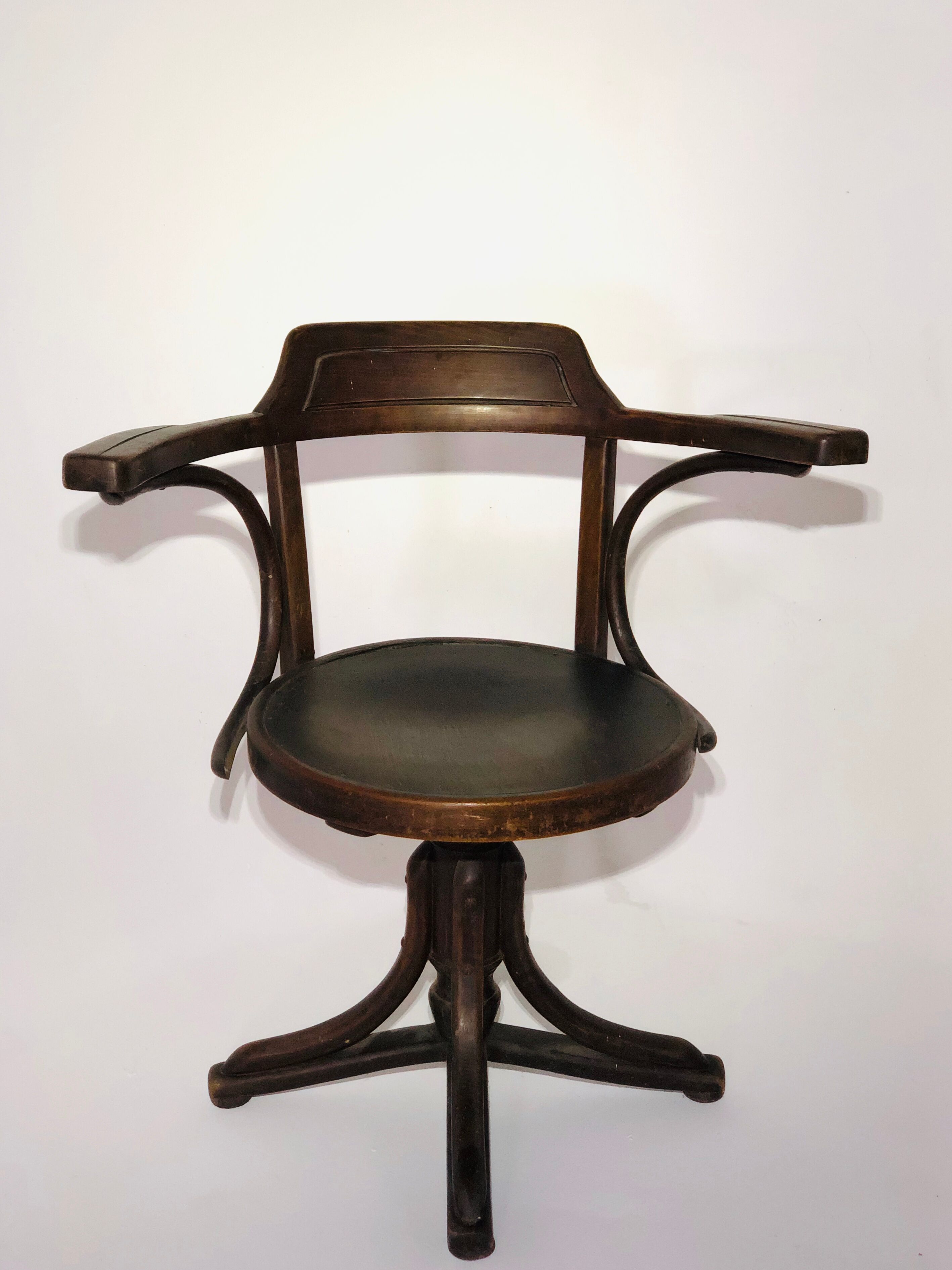 Swivel wooden armchair