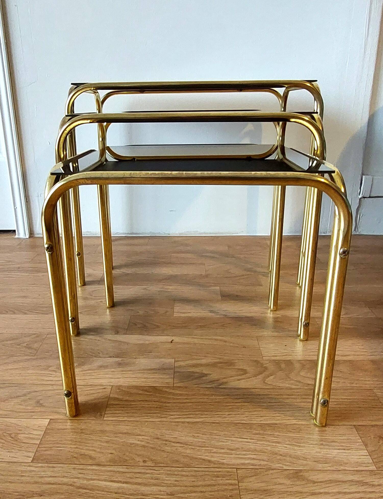 Vintage 1970 gold metal nesting tables.