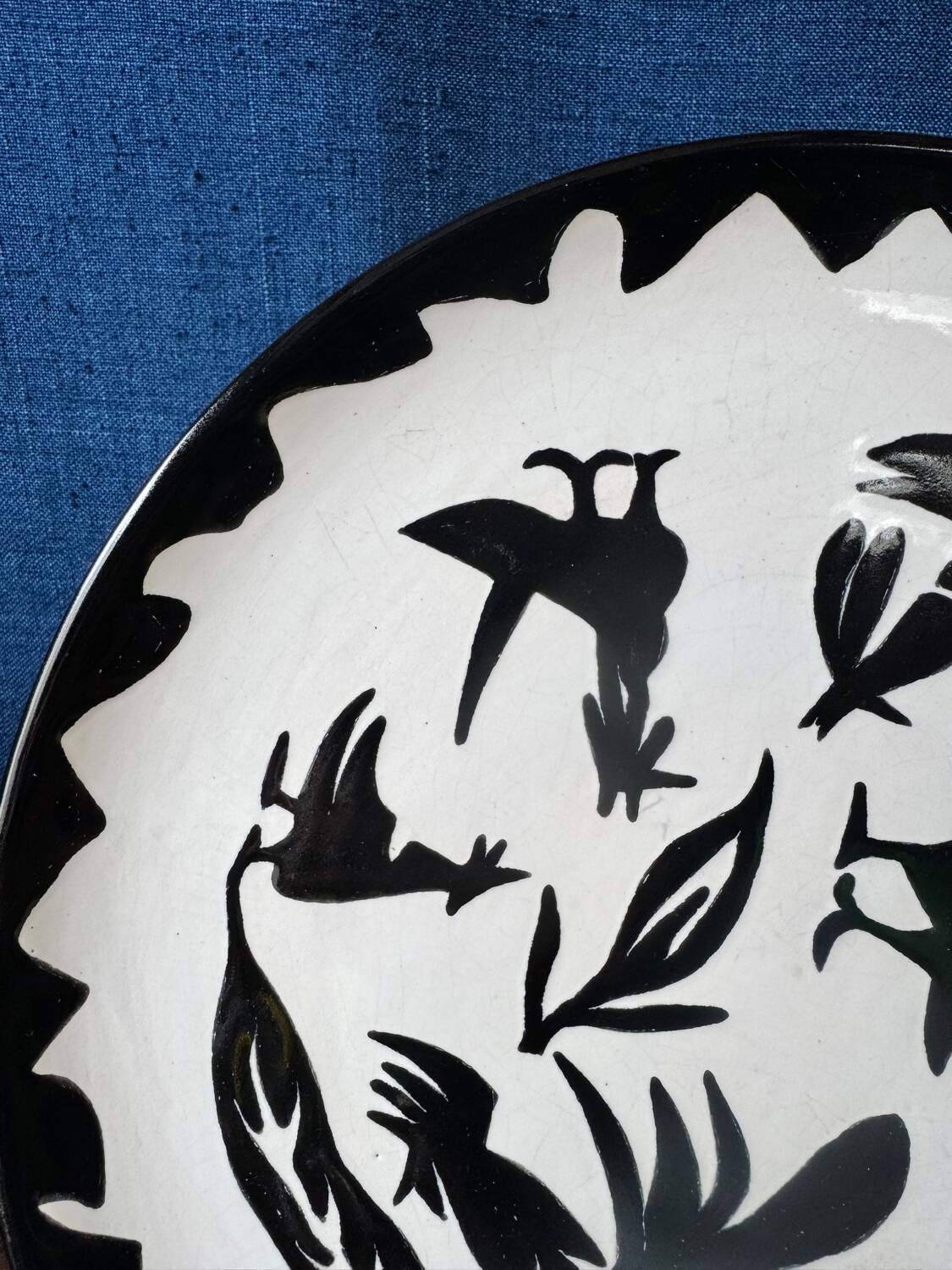 Large ceramic plate J. Lurçat with zoomorphic decoration in black on a white background.