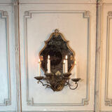Gold metal wall mirror, in the style of Maison Baguès, Paris circa 1950.