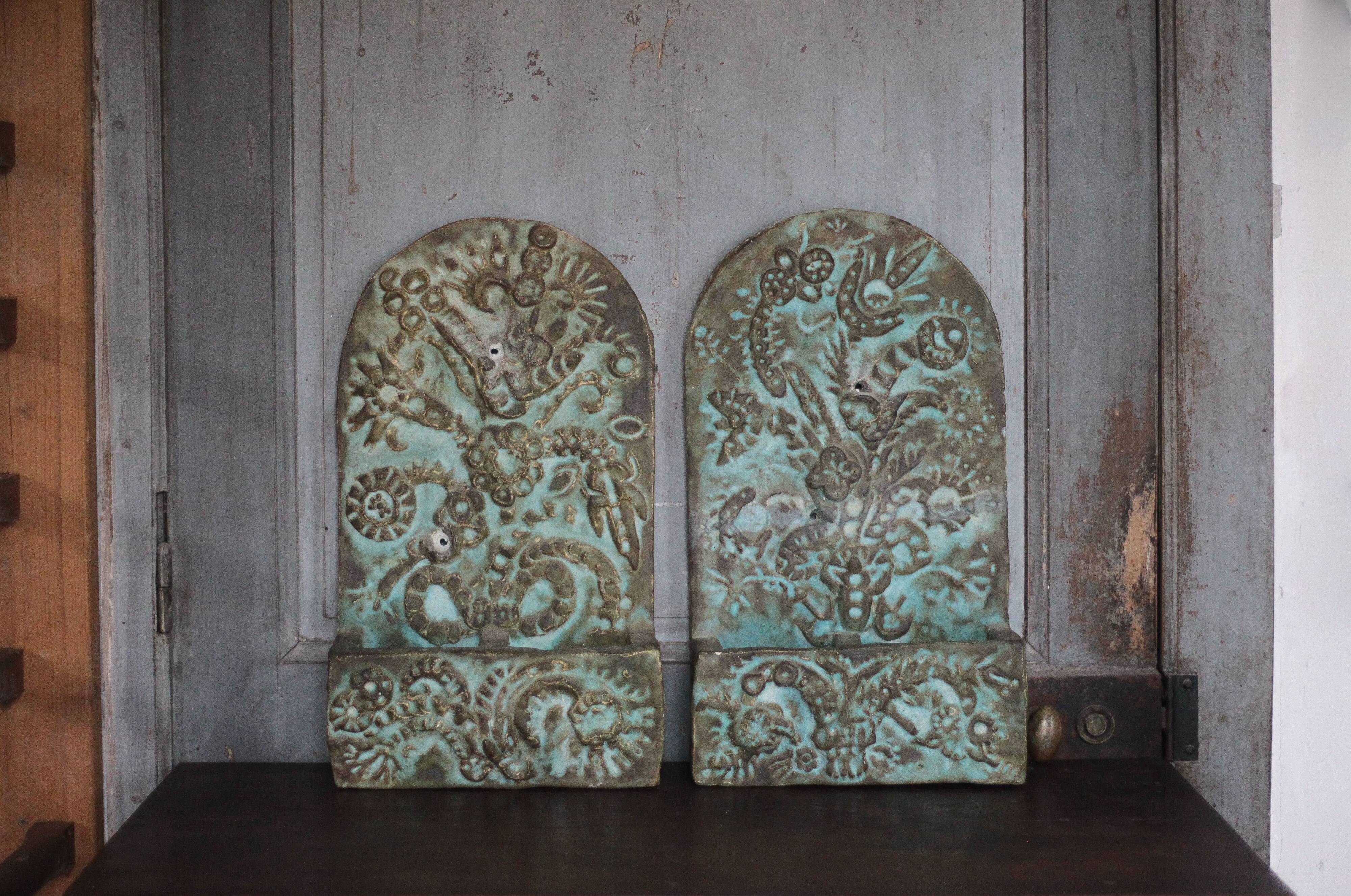 Pair of signed ceramic wall planters, pot cover