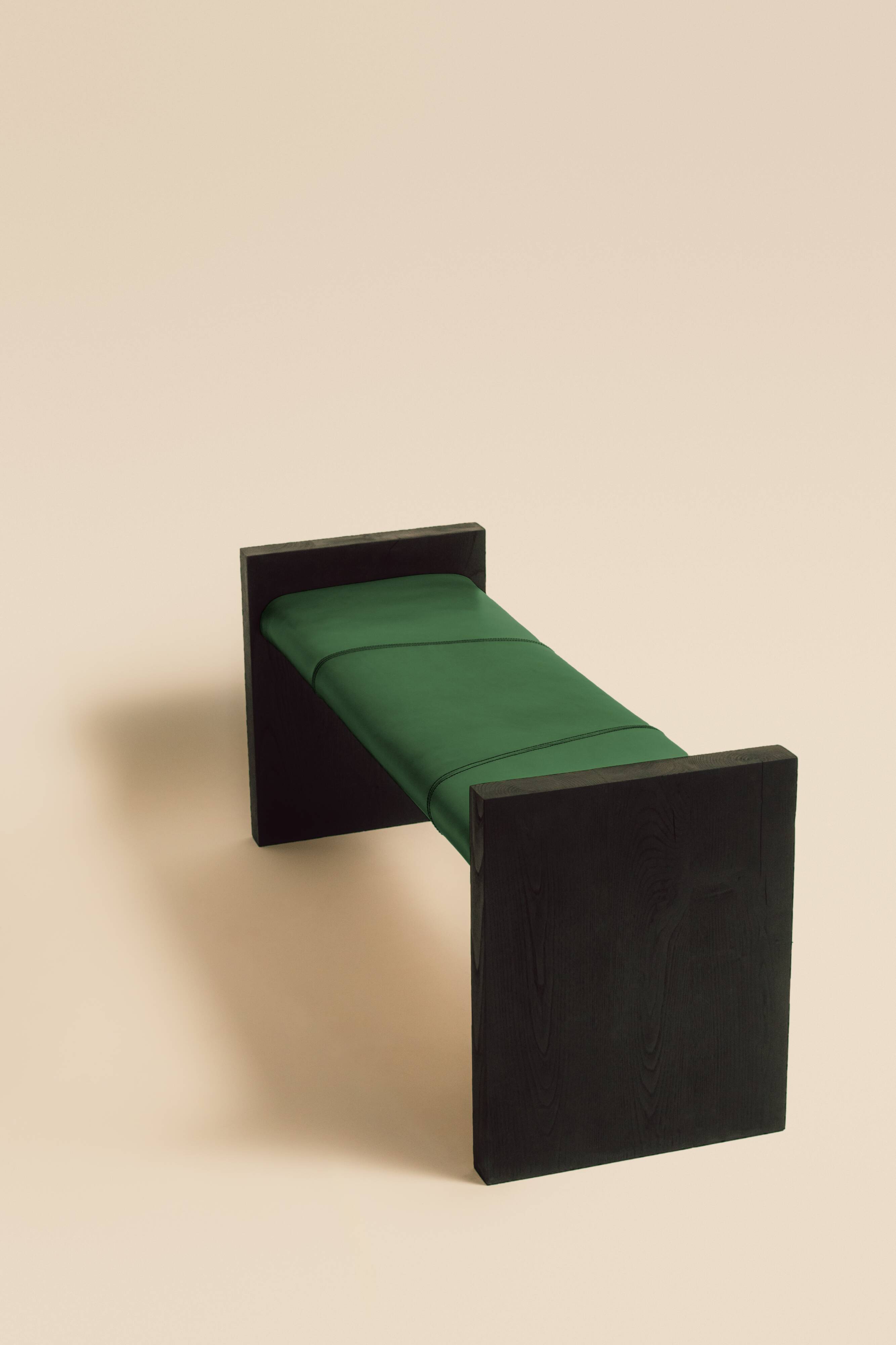 Maërl bench, sepia model, ebonized chestnut and green leather