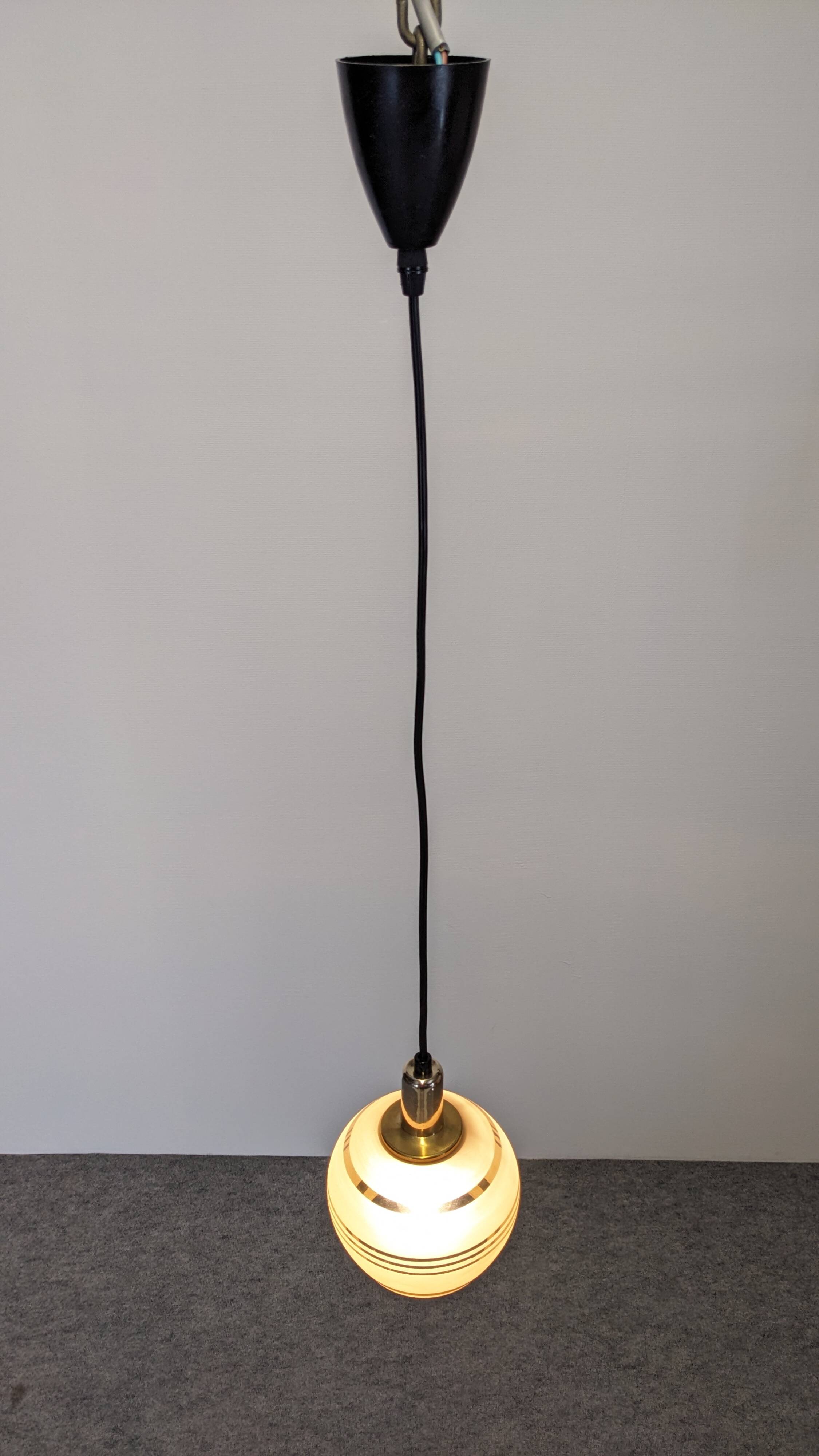 Art Deco style ball pendant light in gold glass