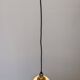Art Deco style ball pendant light in gold glass