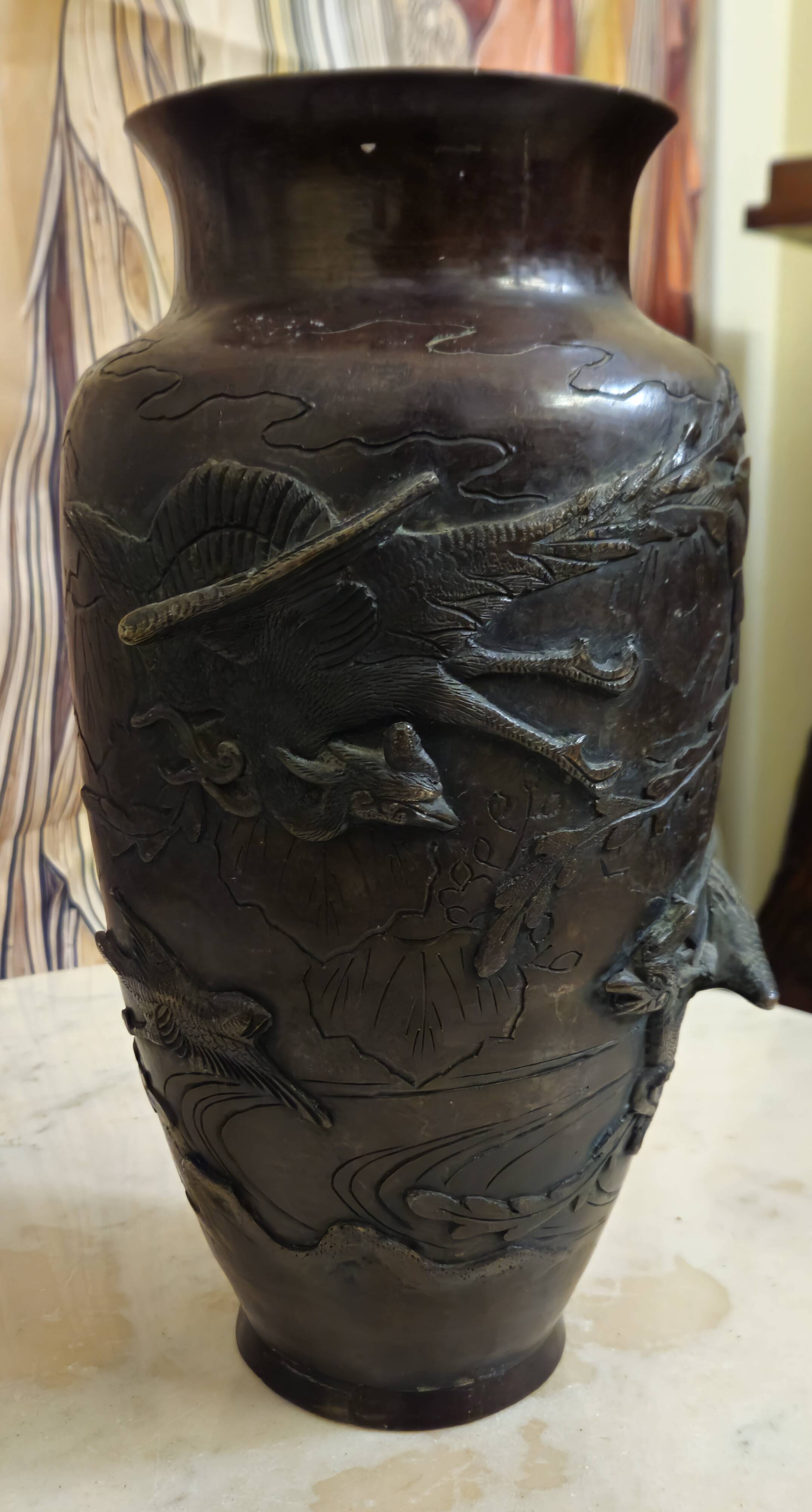 Patinated bronze vase with relief decoration