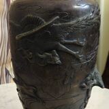 Patinated bronze vase with relief decoration