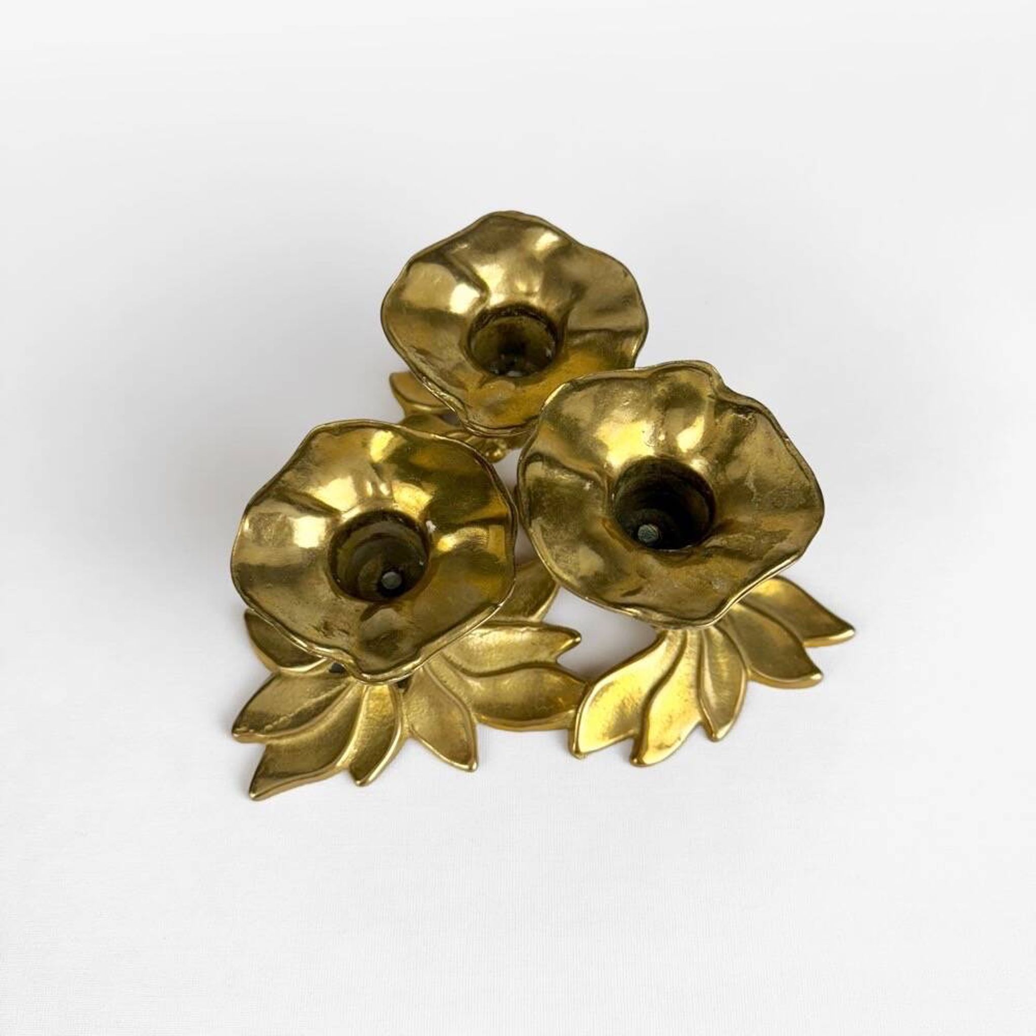 Art Nouveau style three-flower brass candle holder