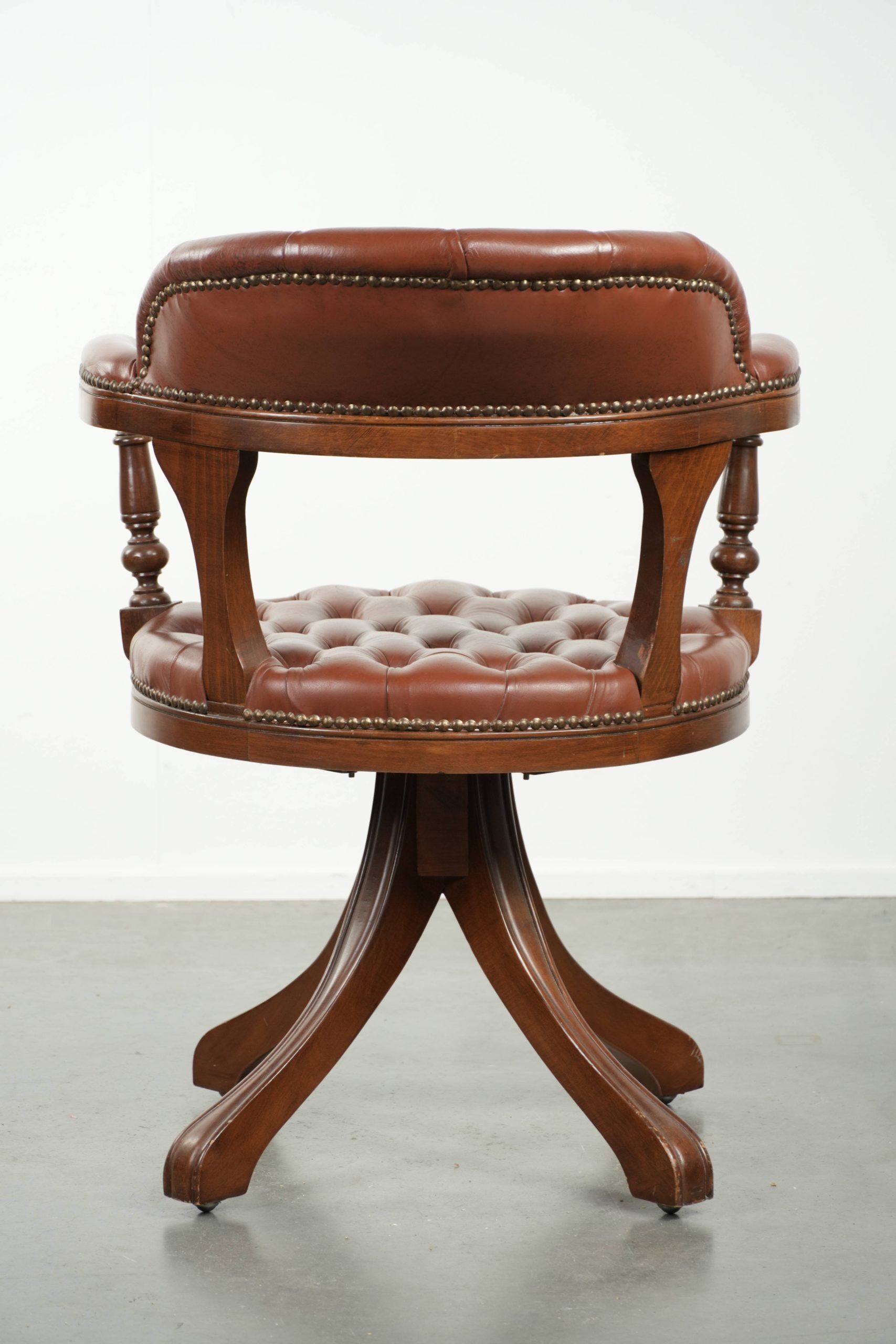 Rotating English style Chesterfield office chair in brown cow leather