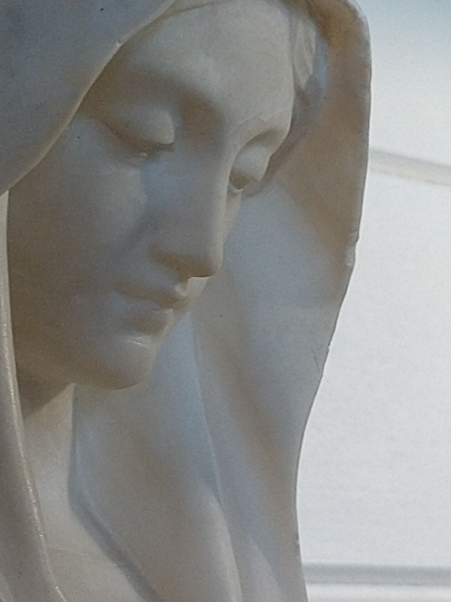 Bust of the Virgin in alabaster by Guglielmo Pugi.
