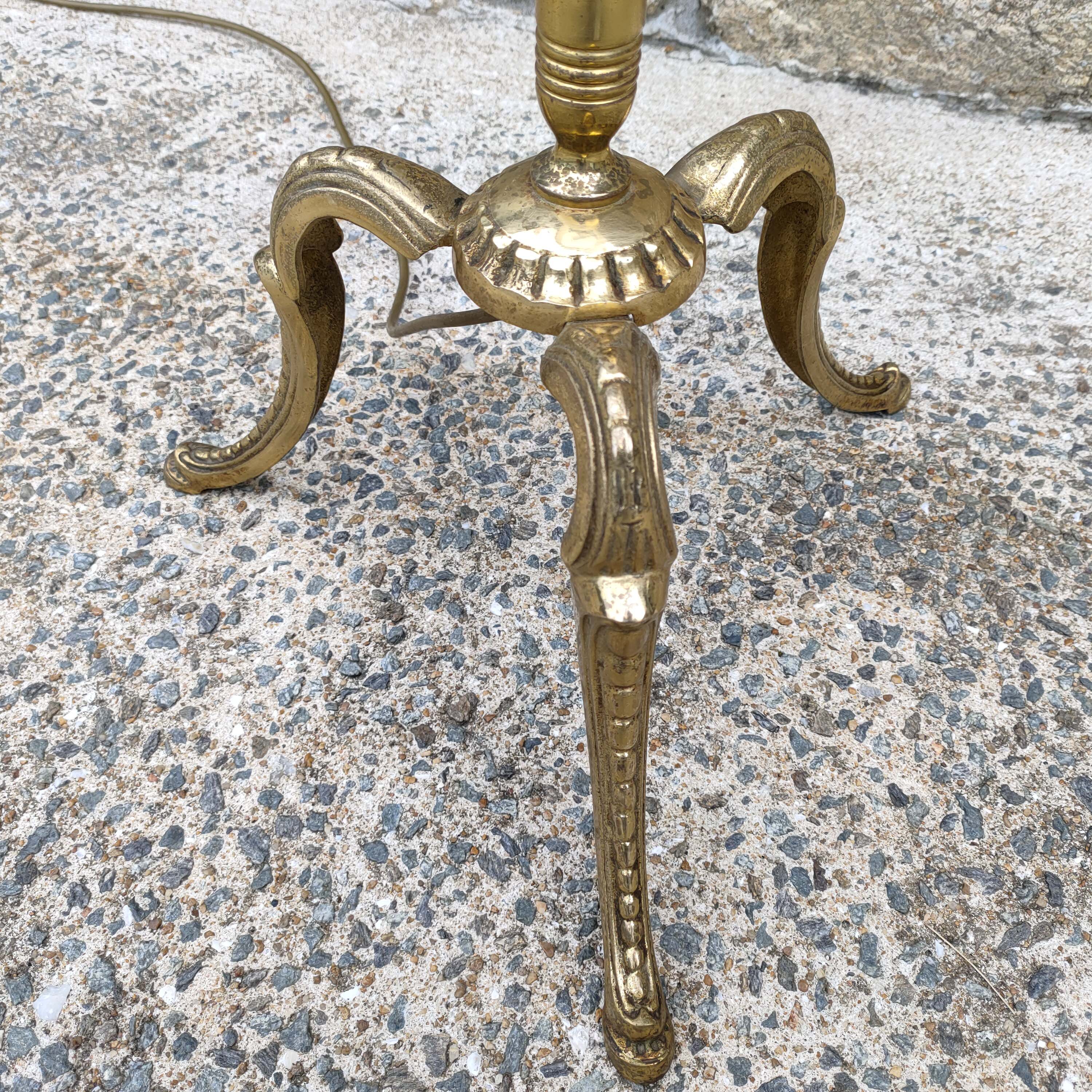 Tripod golden floor lamp