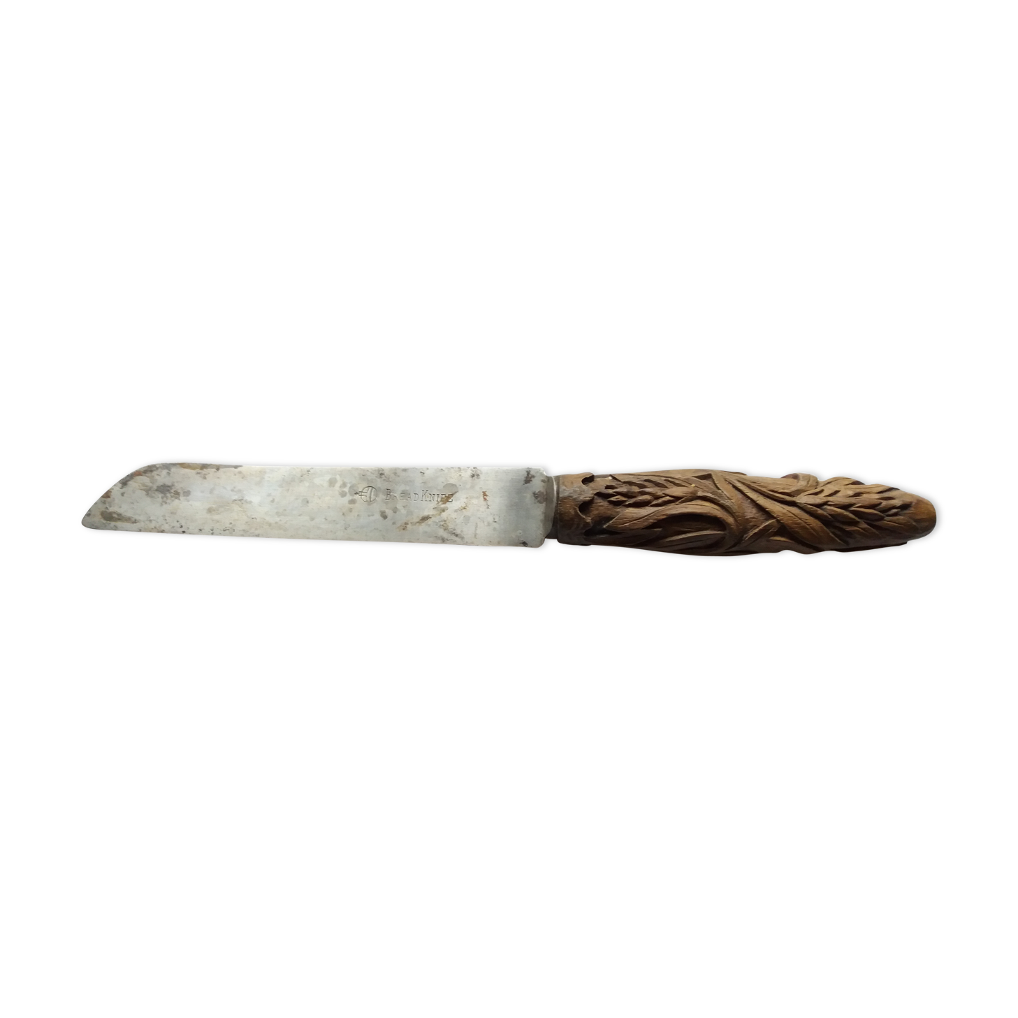 Old bread knife with a carved wooden handle