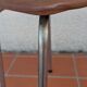Stool covered in faux leather.