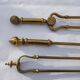 Mismatched set of chimney accessories two pliers and a fire pier
