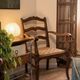 Pair of Provençal armchairs, wood and woven cord — mid-20th century