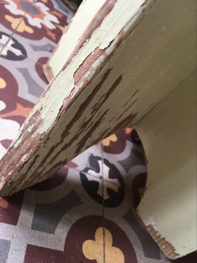 A rough wooden stool patinated by time