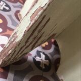 A rough wooden stool patinated by time