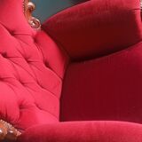 Baroque style carved wooden armchair in burgundy red velvet