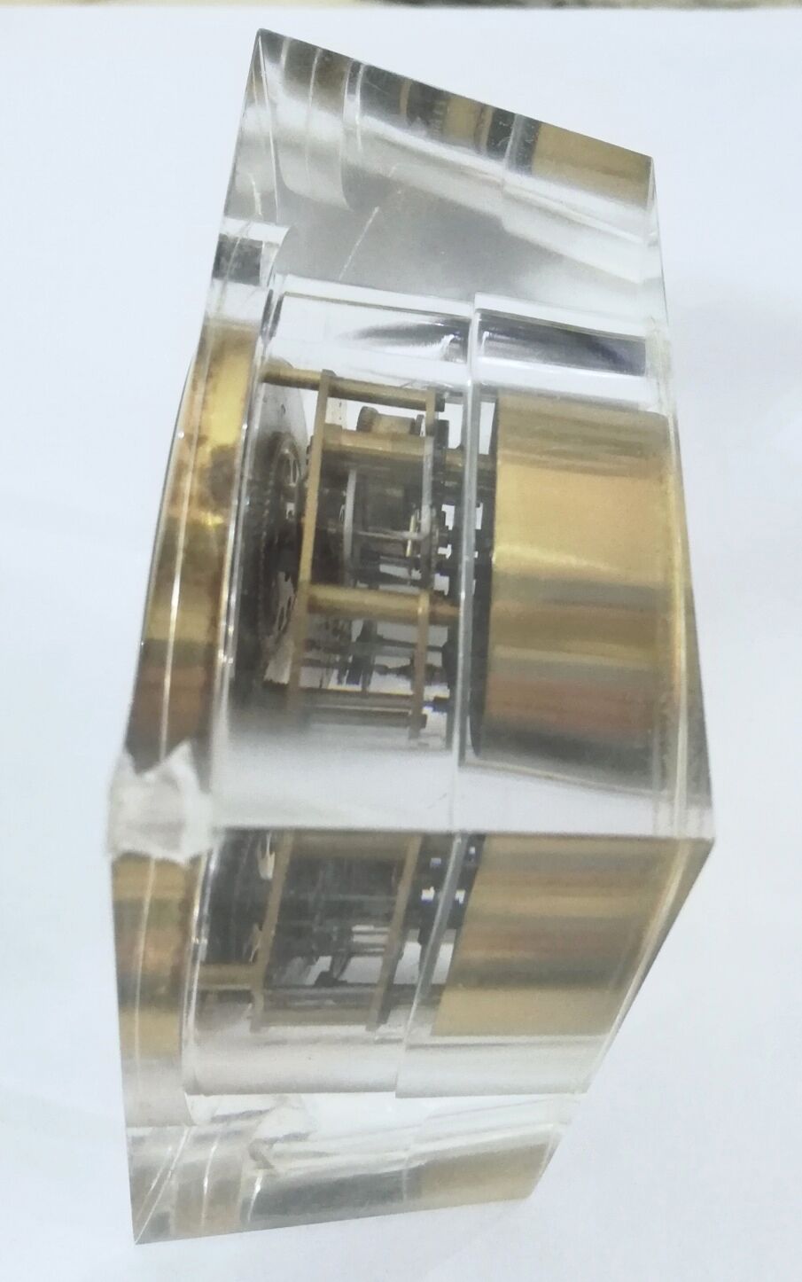 Alarm clock with exposed mechanism in plexiglass and brass