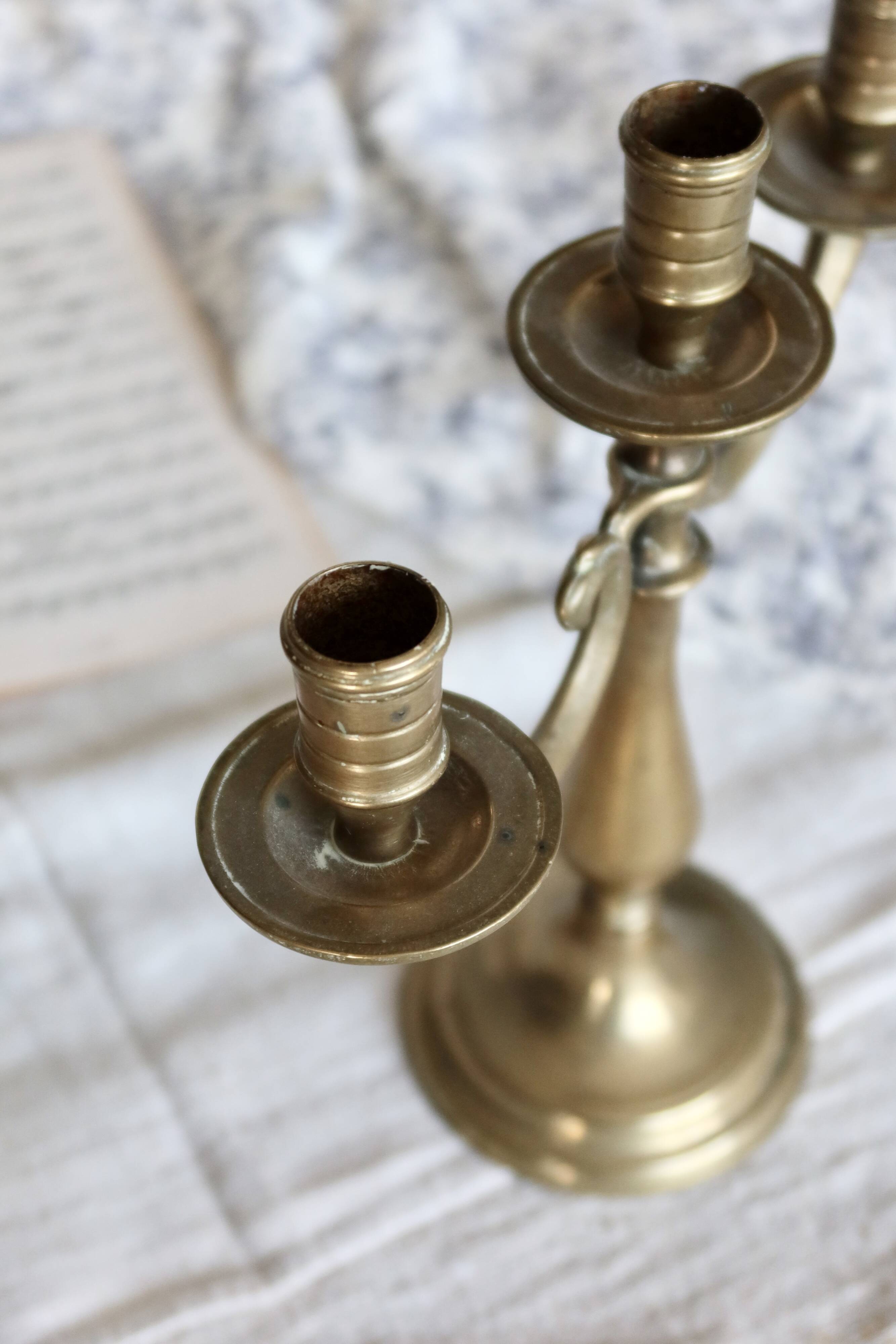 Antique 3-branch candelabra in patinated brass