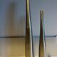 Dyptic vase in brushed chrome metal for single flowers.