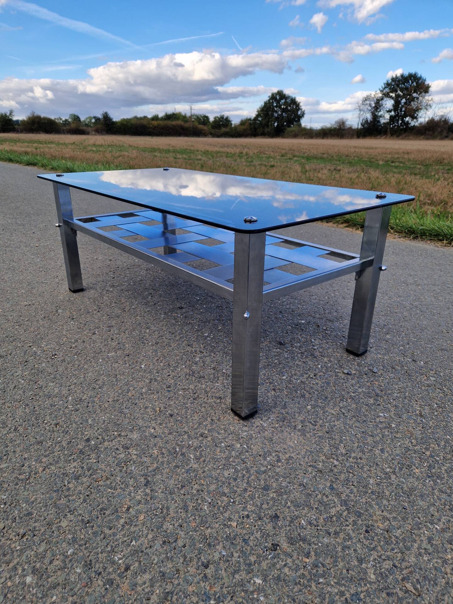 Stainless steel and smoked glass coffee table