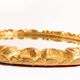Vintage oval decorative mirror in gilded wood with floral frame, Italy, 1960s.