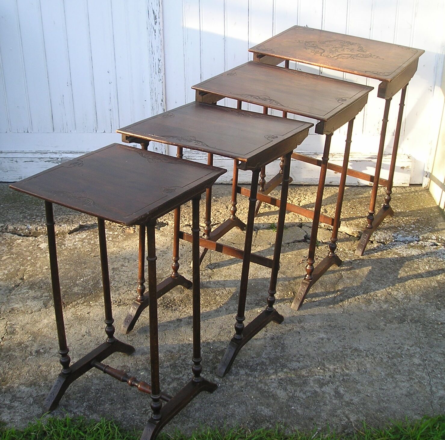 Set of 4 old tables with carved trays